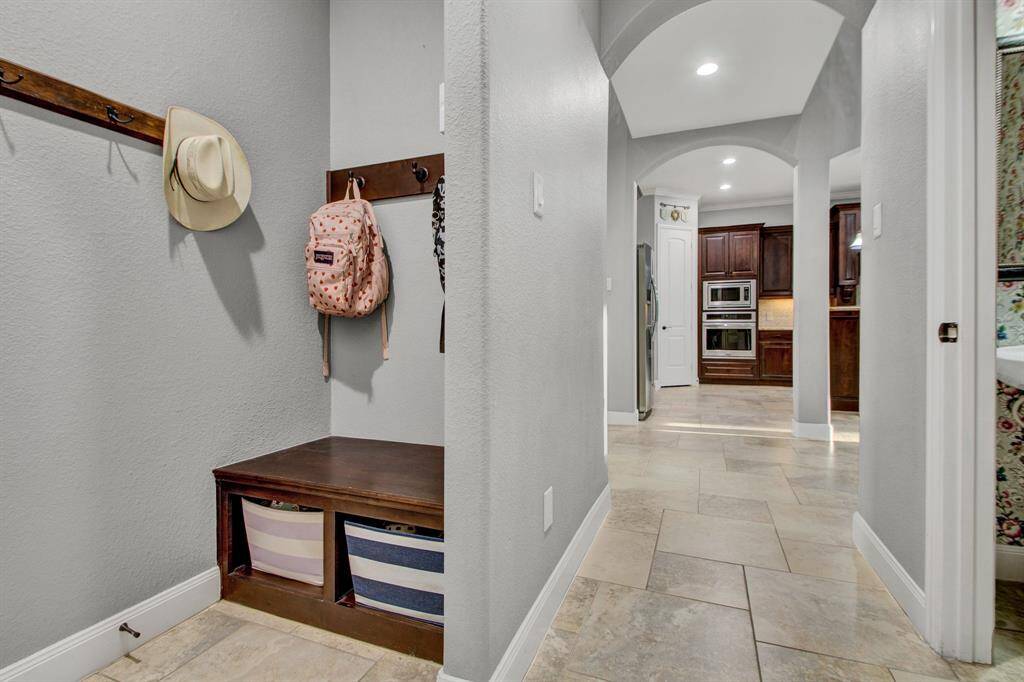 The mudroom area provides the perfect spot to drop off the backpacks after school