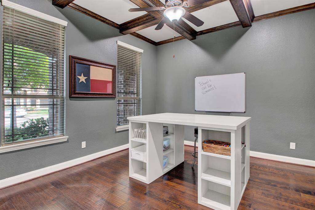 Double doors lead to this private study.  Hardwood floors and amazing ceiling detail!