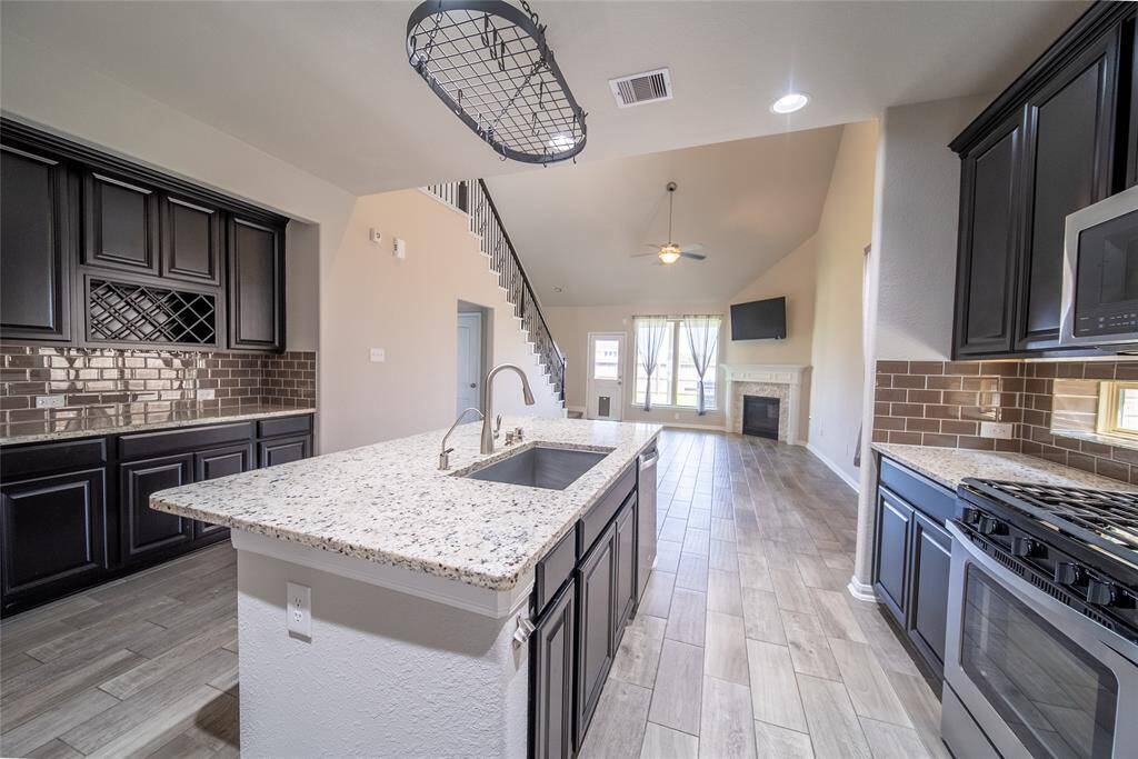 Kitchen island offers lots of counter space and seating