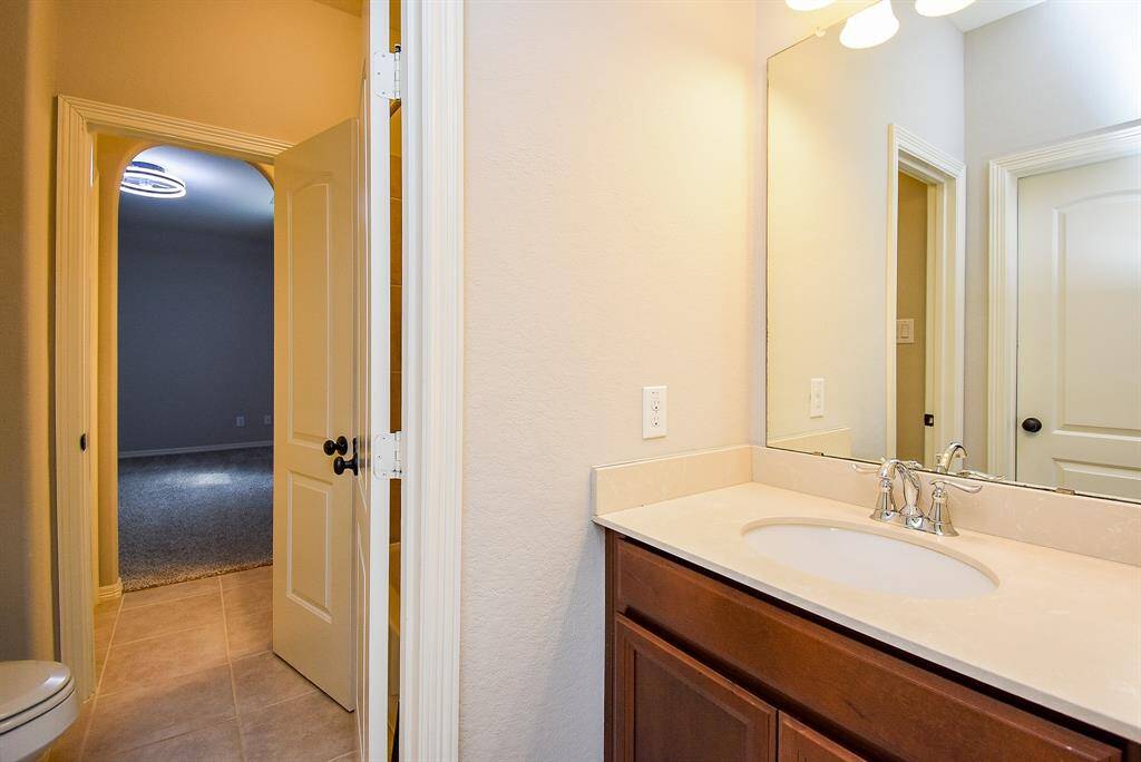Guest Bath with Walk-in-Closet.