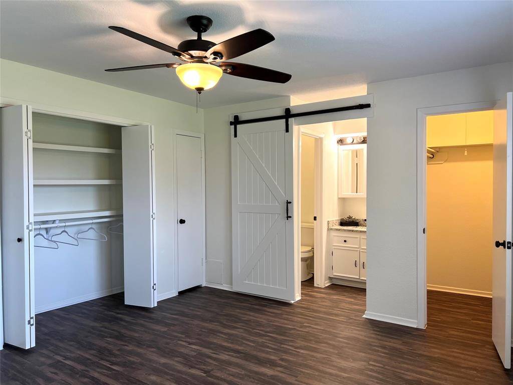 On the other side of the house, the private Master bedroom has a walk-in closet and additional closets.
