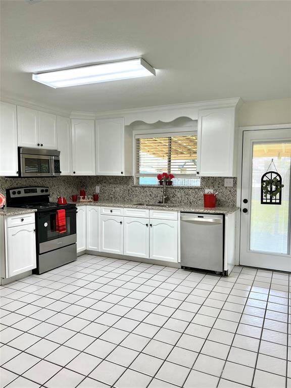 Newly renovated granite kitchen countertops, new sink and faucets, stainless steel stove  and other appliances.