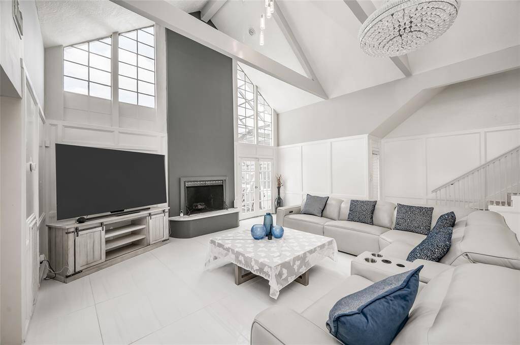 Step into the updated open-concept living room, where modern design meets effortless elegance. This spacious area boasts a seamless flow between the living, breakfast area, and kitchen spaces, creating an ideal environment for both relaxation and entertaining.