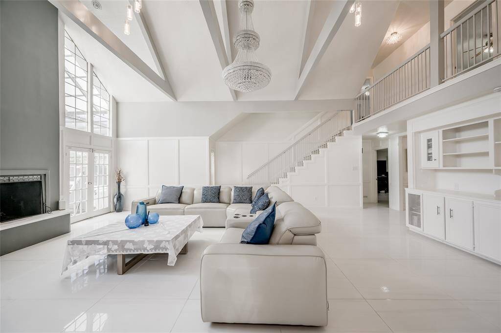 This stunning living room is the epitome of modern living. The open layout and contemporary design make this living room an ideal space for both relaxing and hosting gatherings, blending style, comfort, and functionality seamlessly.