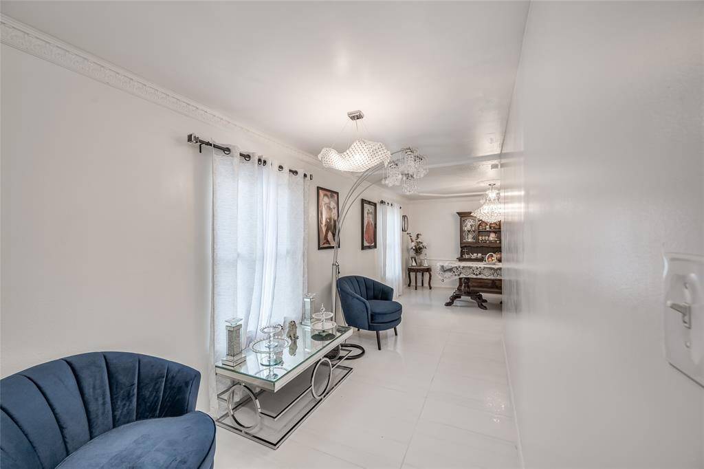 This hall transformed into a cozy seating area perfect for relaxing or entertaining guests. With inviting ambiance and stylish furnishings, this space seamlessly blends comfort and elegance, making it an ideal spot for unwinding or enjoying conversations in a warm, welcoming setting.