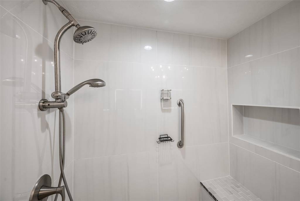 A stunning shower with sleek tiles that exude modern elegance.