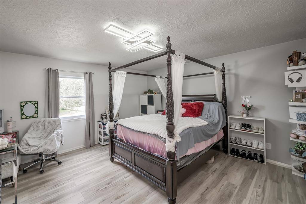 This generous second bedroom showcases its impressive spaciousness, easily accommodating a bed, desk, and additional cabinets.With plenty of room for furniture and storage, this bedroom provides a comfortable and functional space that can be tailored to fit your needs.