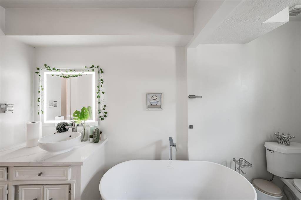 Relax and unwind in the luxurious tub featured in this bathroom. The elegant design and ample size provide a perfect retreat for a soothing soak after a long day. With its classic appeal and modern comfort, the tub enhances the bathroom’s functionality and creates a spa-like atmosphere, making it an inviting space for relaxation and self-care.