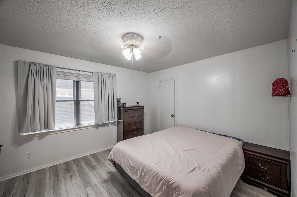 This spacious third bedroom offers exceptional versatility, easily accommodating a bed, a cozy seating area, or even a desk, depending on your needs. The room's generous size allows for various configurations. With ample space and flexibility, this bedroom can be tailored to suit your lifestyle and preferences.