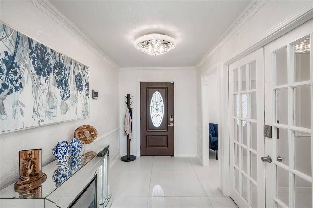 Step into a warm and welcoming entryway that sets the tone for the entire home. With its elegant finishes and practical design, the entryway seamlessly blends style and functionality, offering the perfect introduction to the home’s interior.