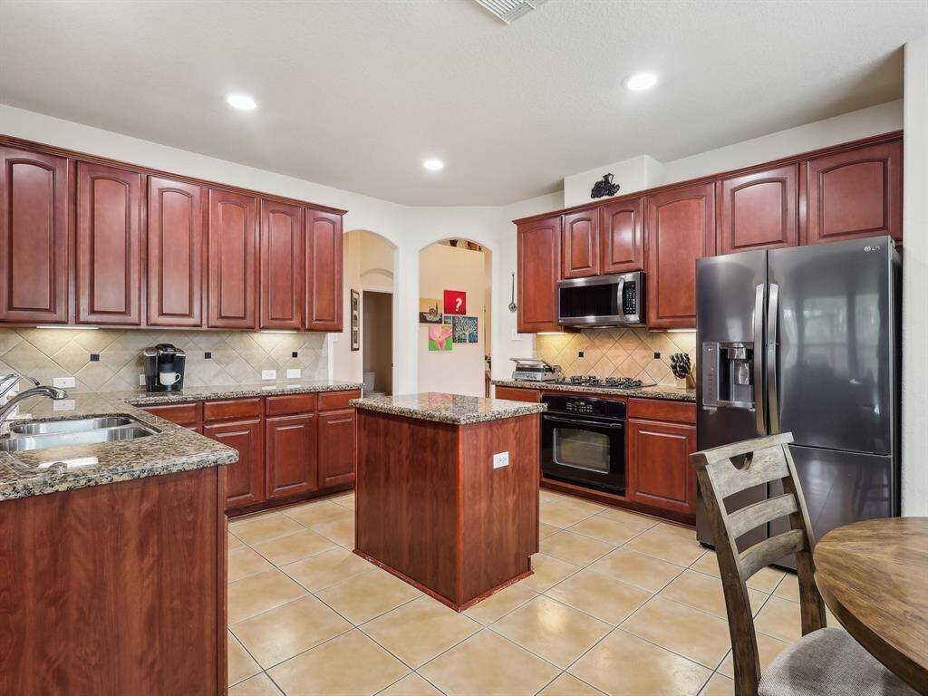 The island adds extra room for prepping your meals.