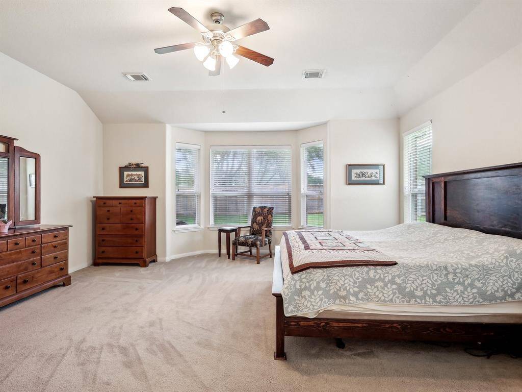 This room has space for a reading area or a desk if needed.