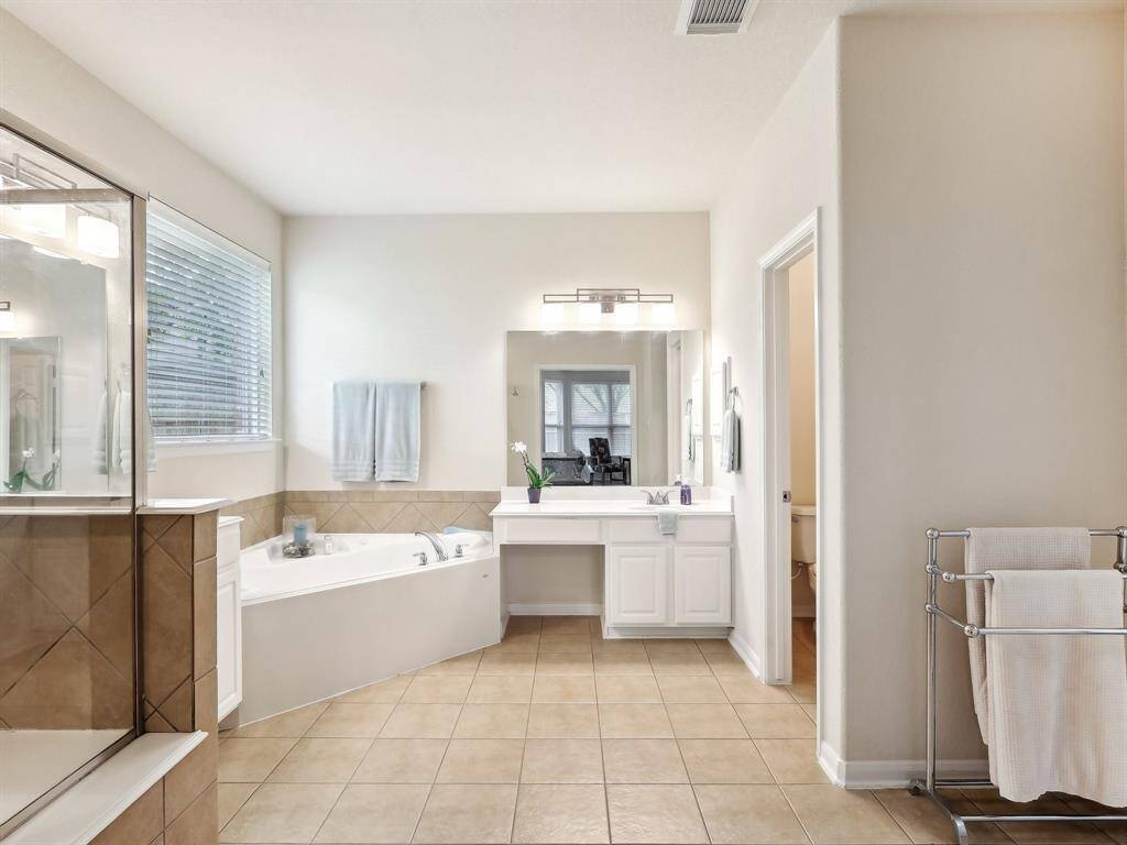 What a perfect place to unwind after a long day! The Primary Bathroom has dual vanities, a corner, jetted tub and separate shower.
