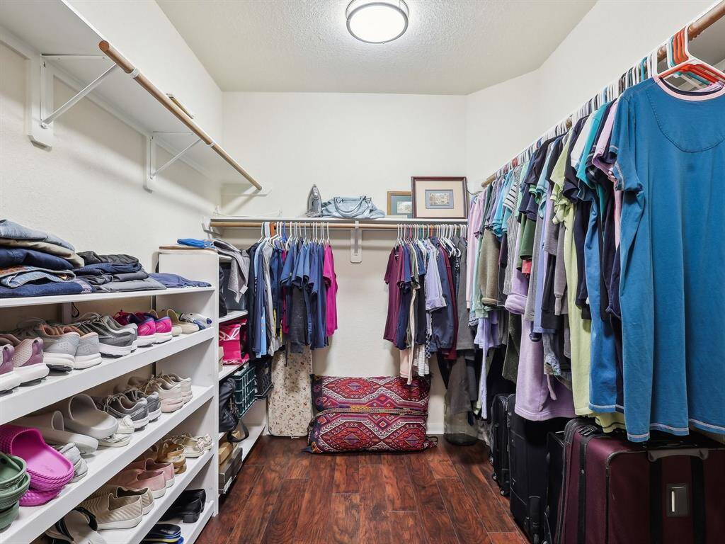 The Primary closet has wood flooring and enough room for all your belongings!