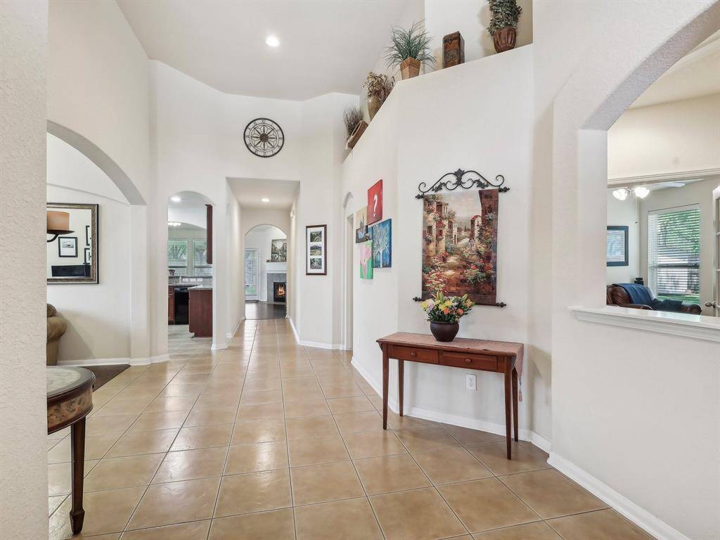 Extensive tile flooring will invite you in! Notice the decorative niches and high ceilings!