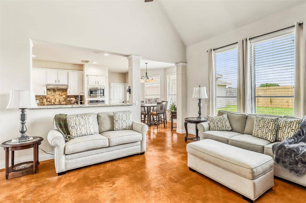 With seamless access to the kitchen and breakfast room, entertaining is effortless in this spacious living area. There's plenty of room for a large sofa and seating, creating an inviting space for gatherings and relaxation.