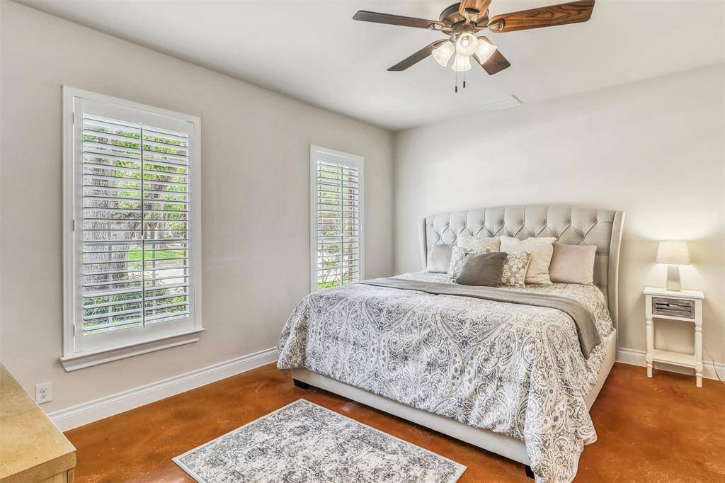 Retreat to the tranquil comfort of the Owner’s Suite, featuring elegant decorator paint and two windows with plantation shutters that fill the room with natural light.