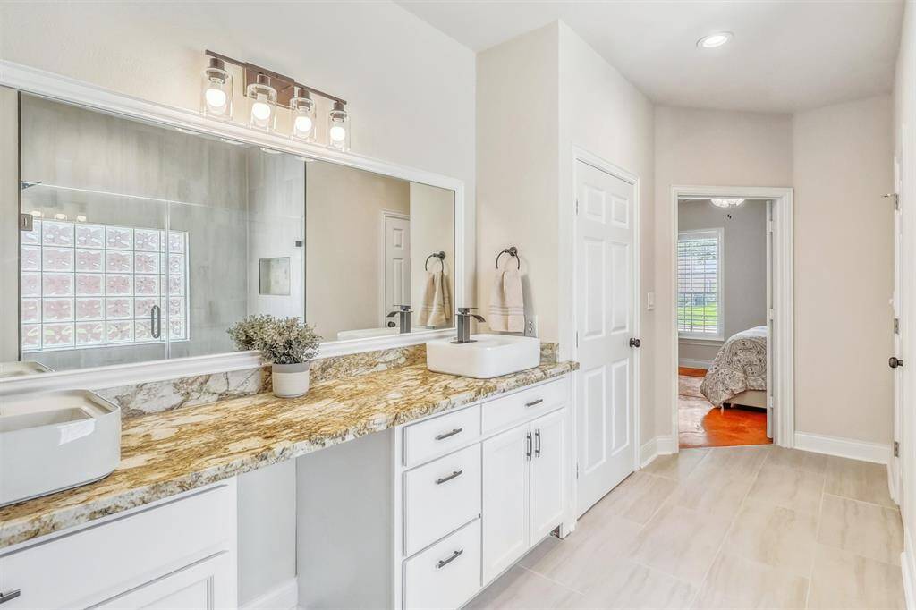 Recently upgraded floors enhance the space, while an added linen closet provides extra storage, combining both style and functionality for everyday convenience.