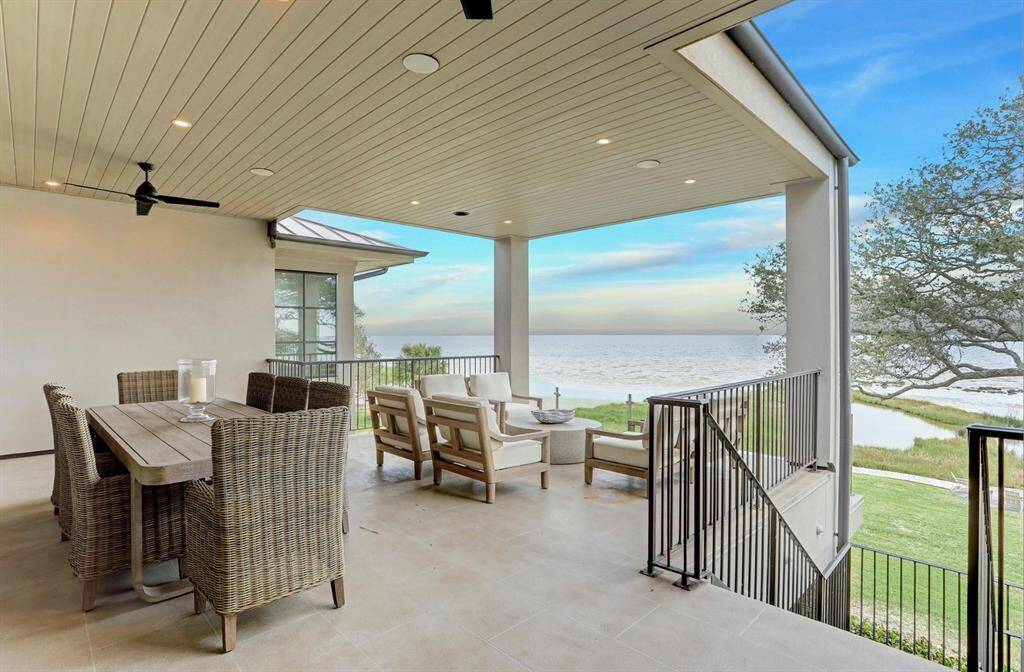 Take in the beauty of the bay as you watch the boats go by on your spacious terrace - one of many outdoor areas this home offers.