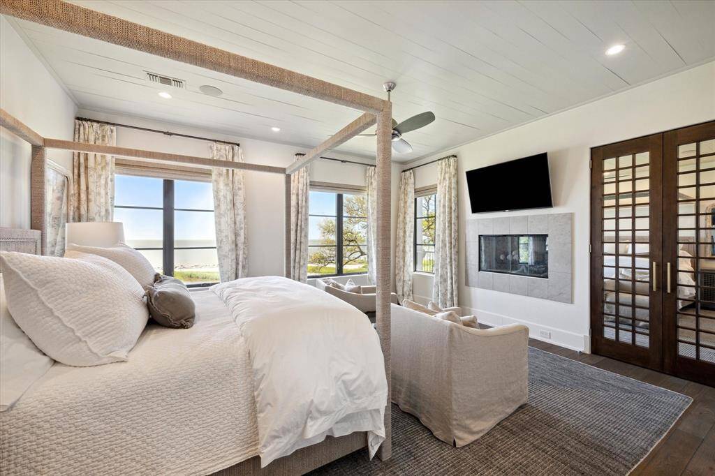 Complete with a fireplace, a spa-like en suite bath, and expansive views of your private beach - the primary suite is in a word: tranquility.