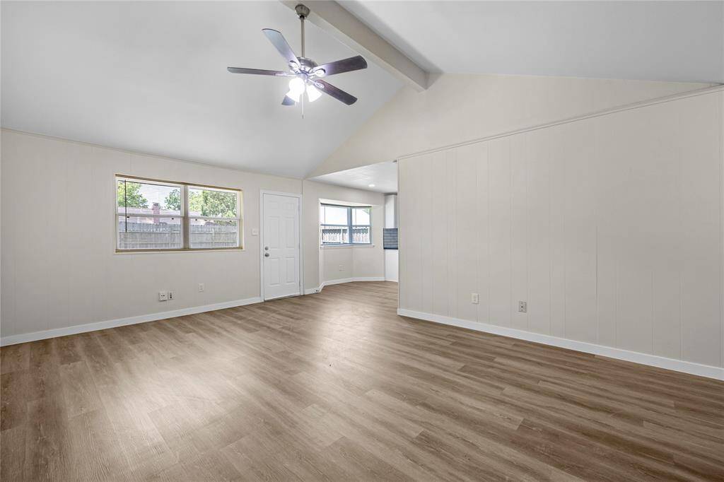 Open concept living space with laminate flooring.