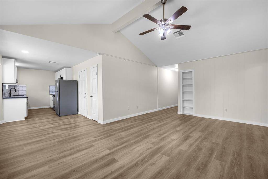 Spacious living area with neutral tones.