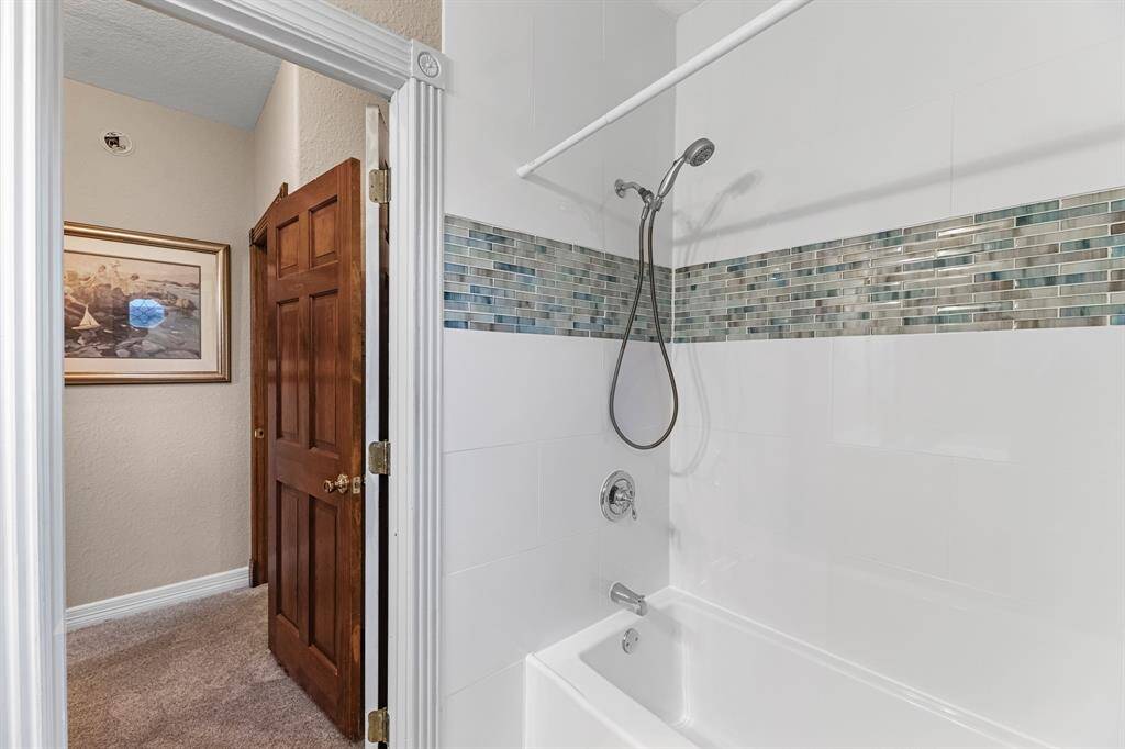 Elegant (2025) secondary bathroom featuring modern fixtures and stylish tile accents.