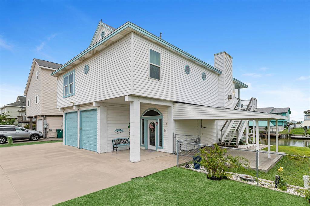 Charming waterfront home featuring 2 spacious covered patios, perfect for relaxing and entertaining.
