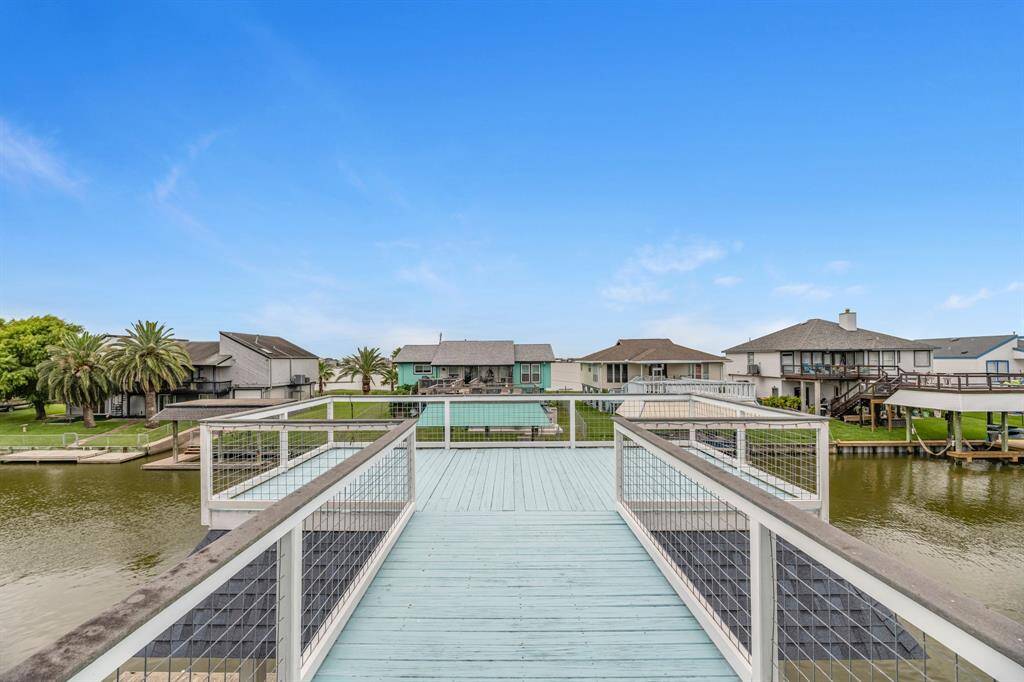 Picturesque waterfront view from a spacious deck. Perfect for those seeking a serene, coastal living experience.