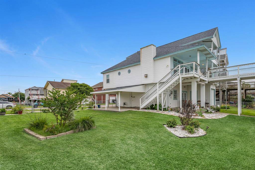 Spacious extra lot with programable sprinkler system, offering endless potential for expansion, gardening, or outdoor activities.