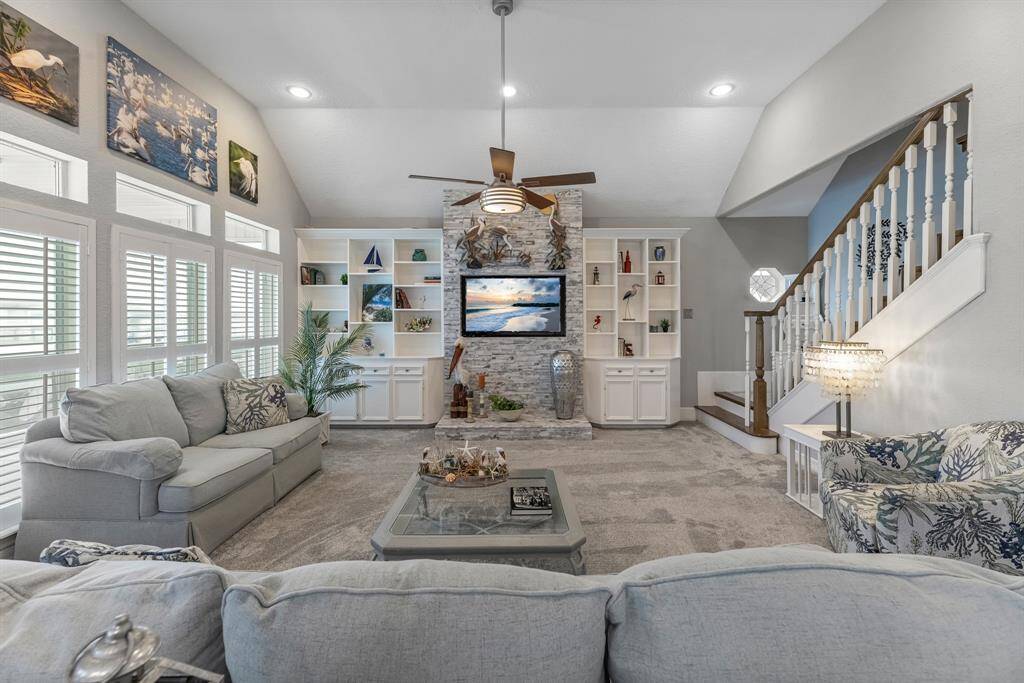 The neutral color palette and (2023) plush carpeting create a warm, inviting atmosphere.