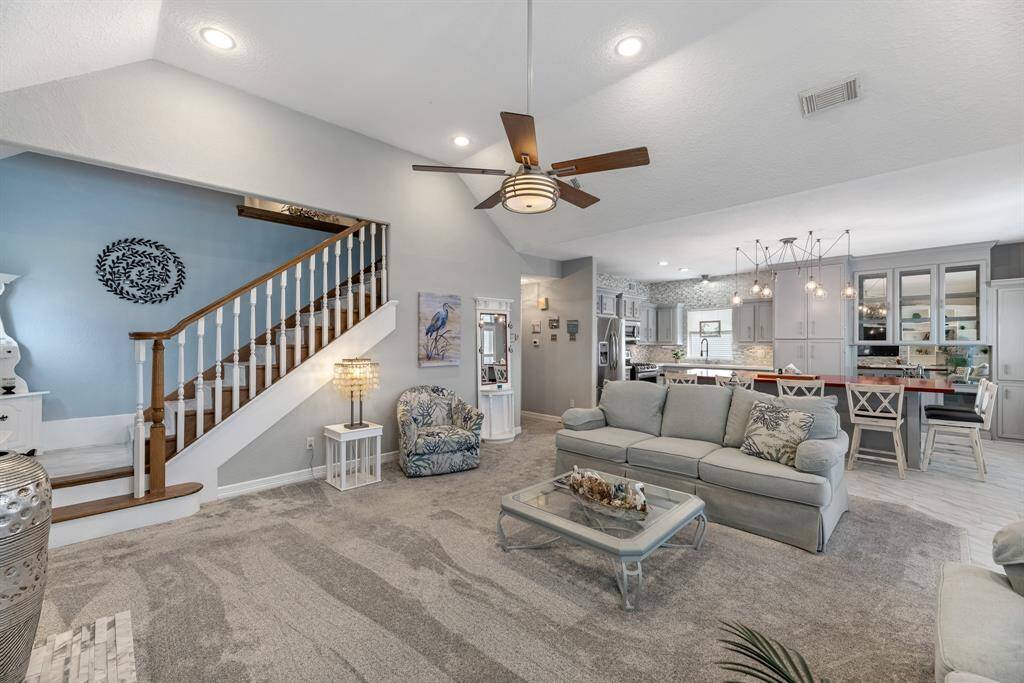 Elegant staircase leading to the serene primary bedroom.