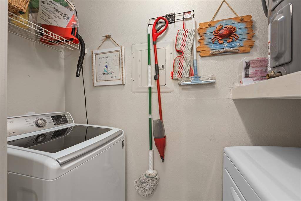 Utility room in back of kitchen has full size washer and dryer that also convey.