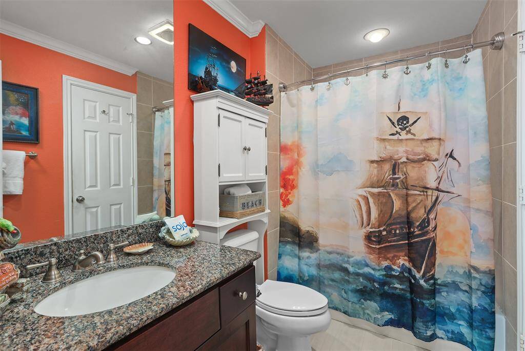 Bathroom has a tub/shower combo.