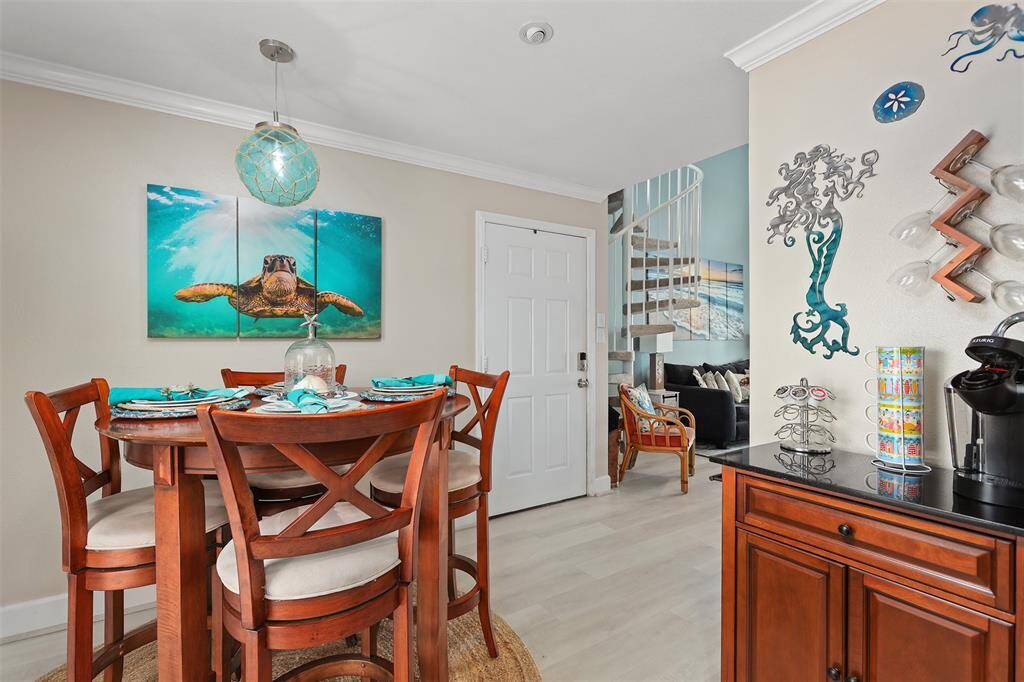 Separate dining area conveniently located between kitchen and living room.
