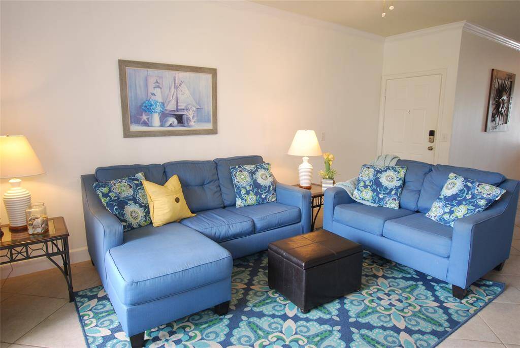 Condo has tile floors throughout the living space for easier cleanup.