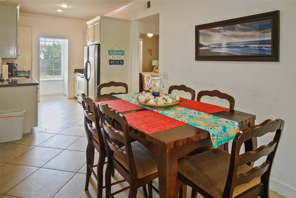 Dining area leads to kitchen.