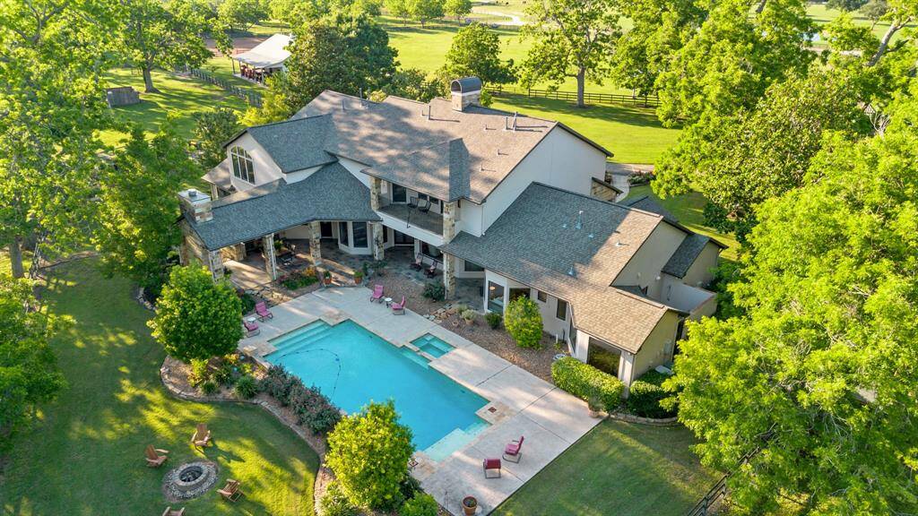 Exquisite custom built home on almost 10 fully fenced acres backing up to the creek.