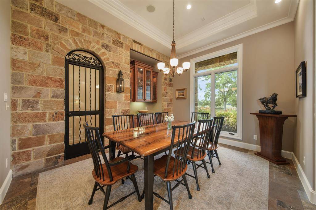 Dining room with gas lamps & wine cellar.