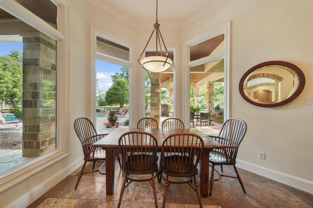 Beautifully lit breakfast area with views of the pool & landscape.