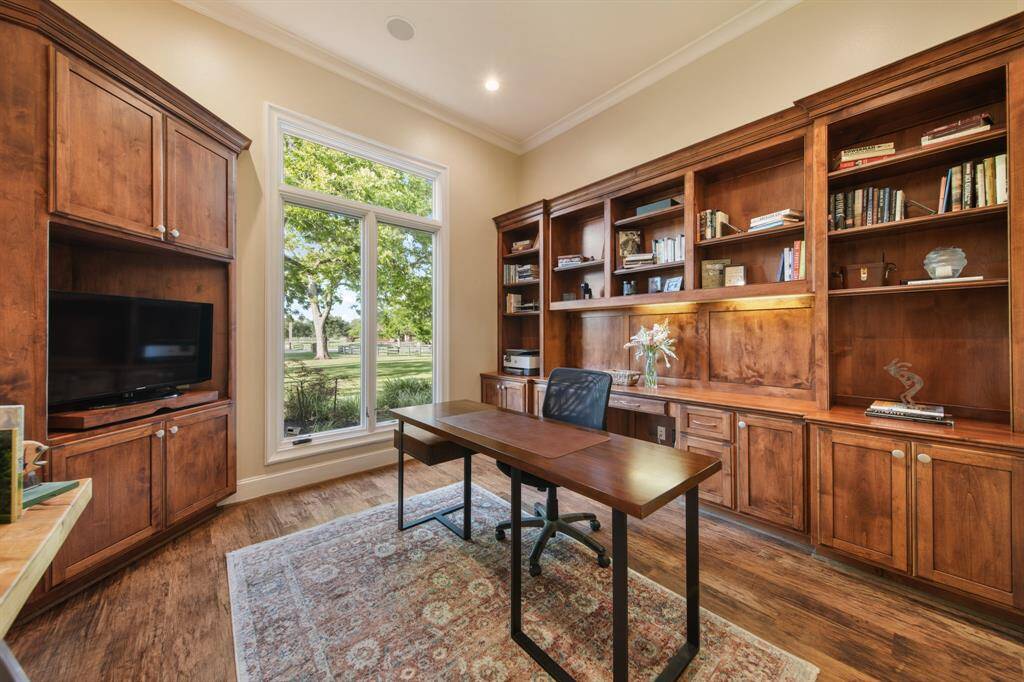 Spacious office on first floor with custom built-ins.
