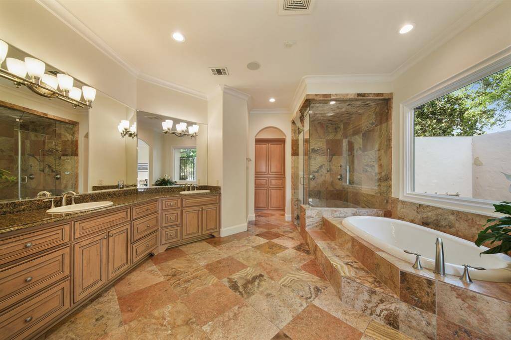 Primary bathroom with steam shower & soaking tub.