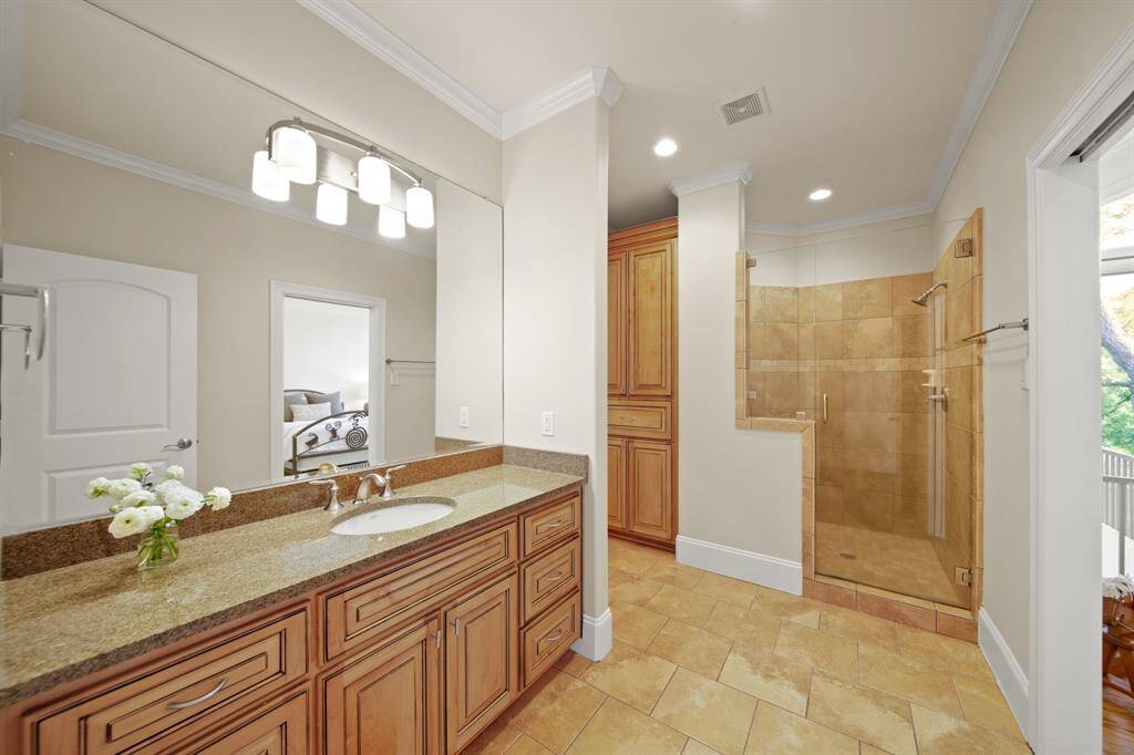 Upstairs ensuite bathroom #4 with shower and built in storage.