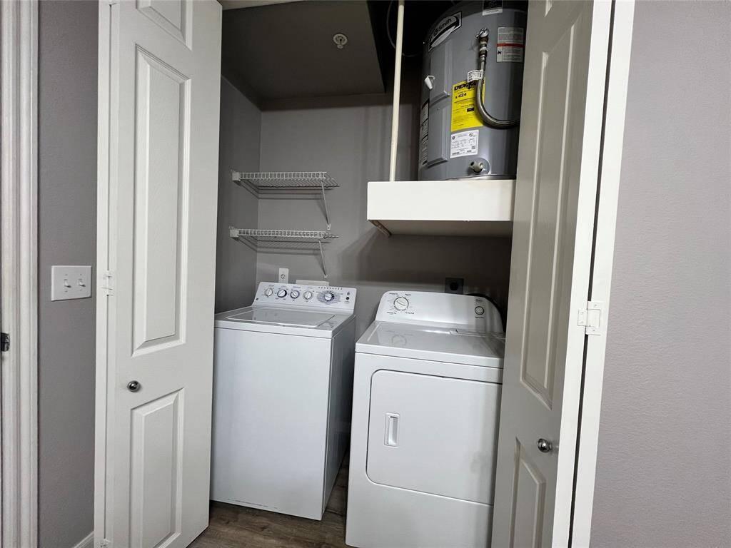 The full-size washer and dryer are in the bathroom.