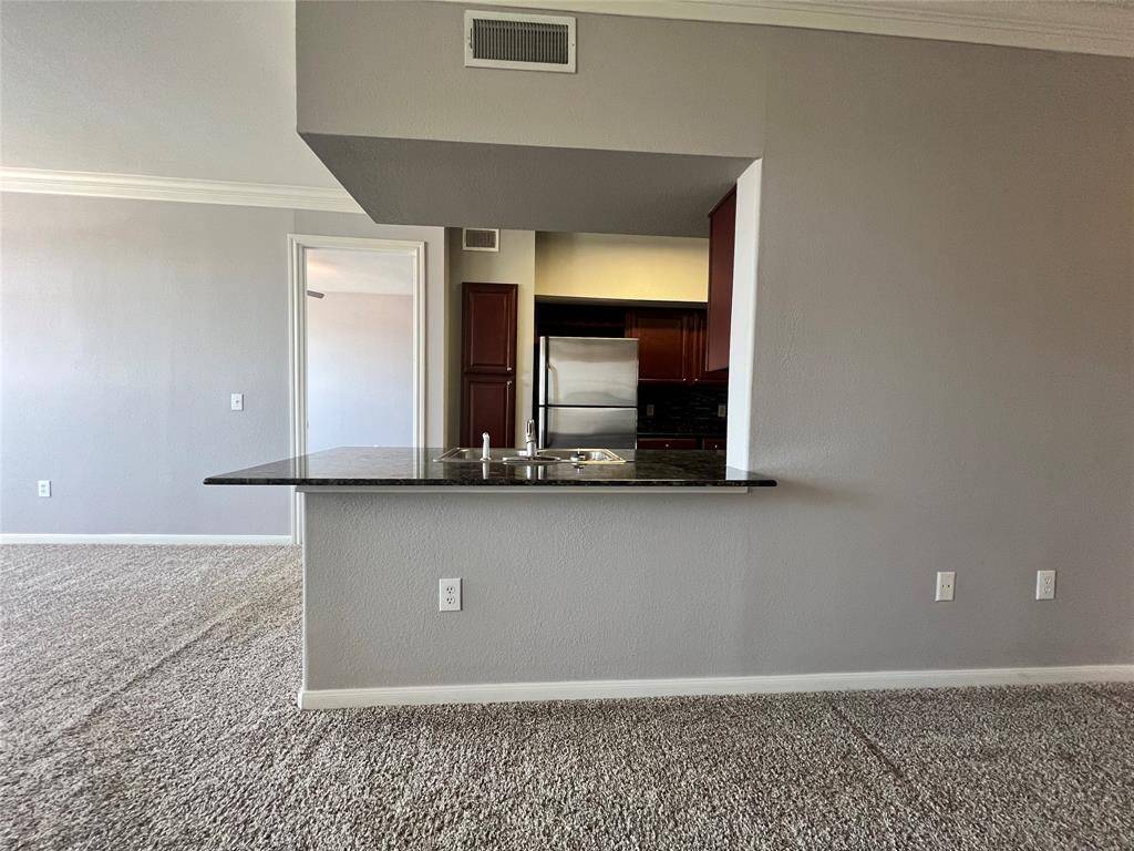 This view shows how the kitchen is open to the living and dining areas.