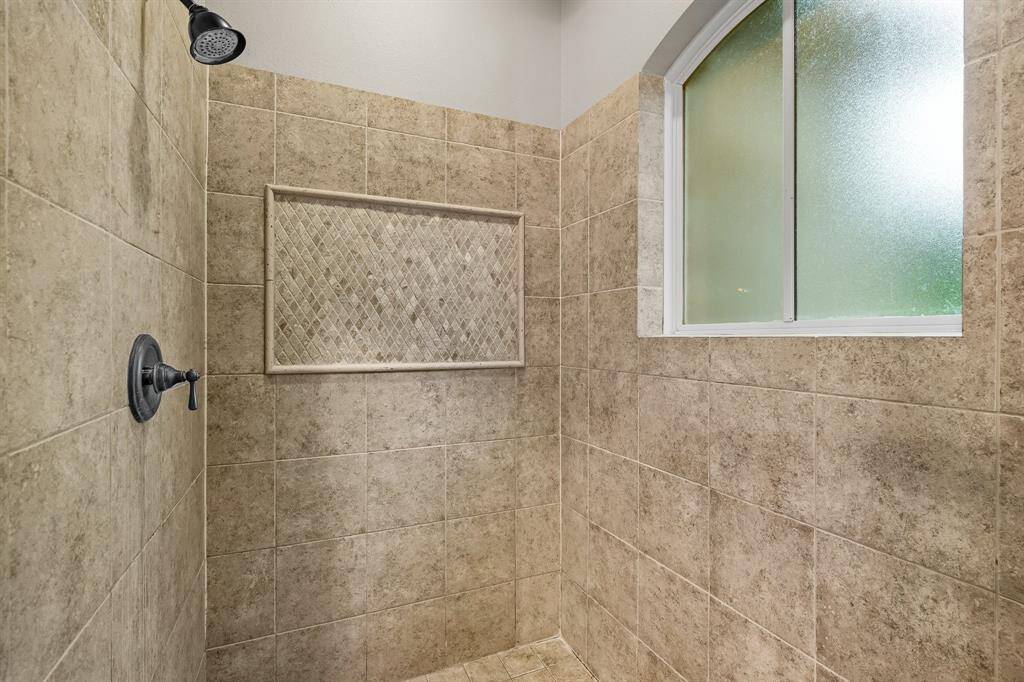 Spacious shower in primary bathroom.