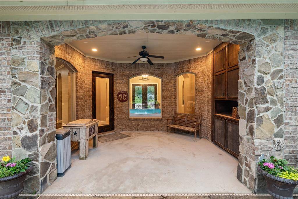 Covered patio off the back door with storage for all things pool!