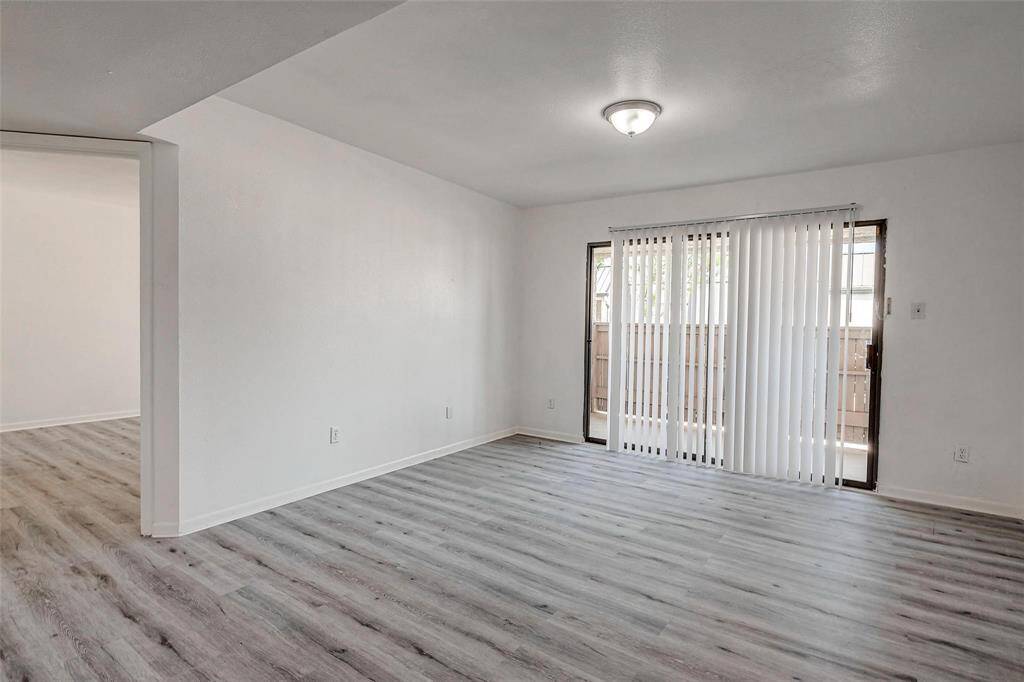 A large living area with attached private balcony