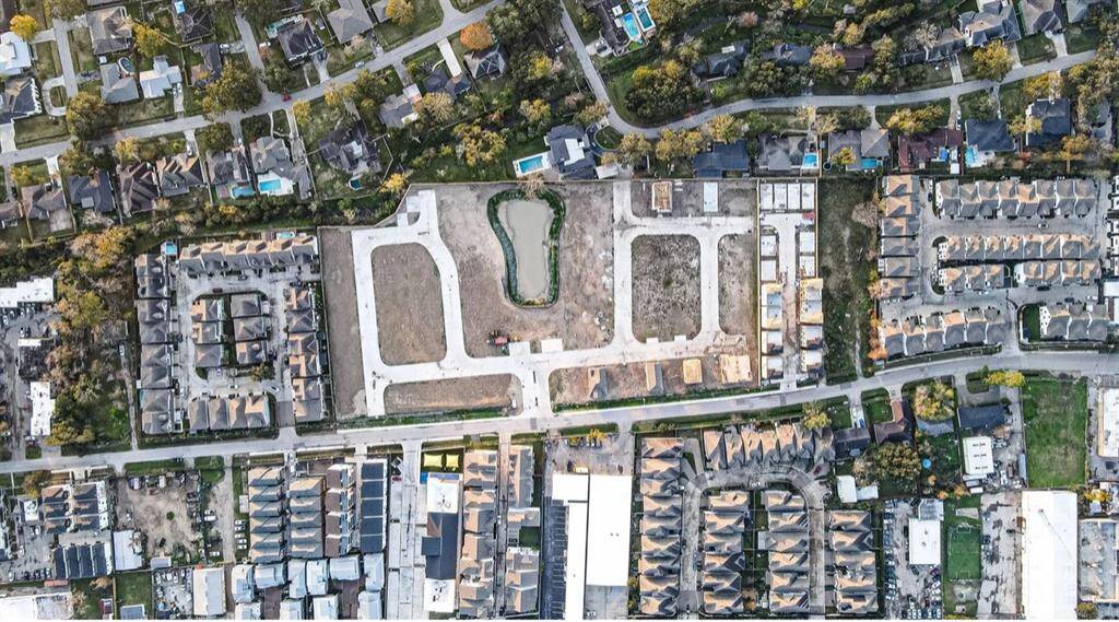 Here you see an aerial view of the 85 home community acreage with the pond, Pool and community center as the focal point.