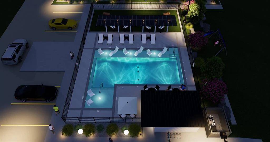 Here is a nighttime view of the beautiful Spring Valley Creek vacation style swimming pool.